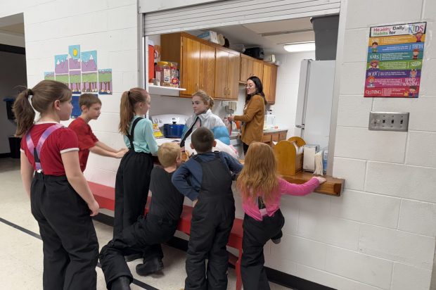 Calder students wait for lunch.